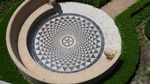 Outdoor sitting area with spiral decorated floor